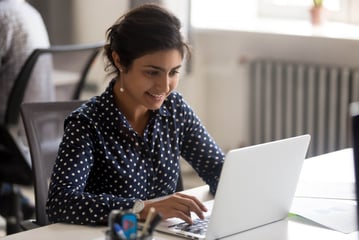 bigstock-Smiling-Indian-Female-Employee-273281791